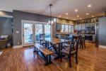 Open dining and living area with patio doors to the front porch